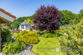 Gelegenheit: EBK-Bungalow mit traumhaft angelegtem Garten, ca. 792 m² Grundstück in 23747 Dahme - Garten